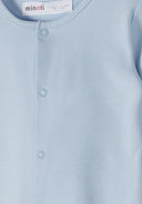 Close-up of a soft blue baby sleepsuit featuring snap button design and breathable cotton fabric for comfort.