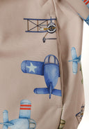 Detail of boys' softshell jacket with aeroplane print in sand color.