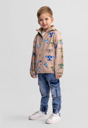 Boys softshell jacket in sand with aeroplane print, front view, features attached hood and zippered pockets.