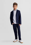Boys slim fit navy blue formal trousers with side pockets and zip-fly fastening.