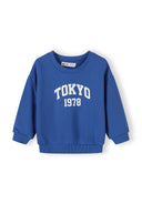 Blue boys sweatshirt with ribbed cuffs and hem featuring a white "TOKYO 1978" urban design print