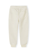 Cream-colored kids joggers with elastic waistband, ribbed cuffs, and a single back pocket showcasing a simple design.