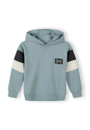 Blue kids hooded sweatshirt with contrasting black and white sleeve panels and unique chest patch design