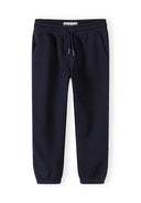 Dark blue boys joggers with elastic waistband and drawstring, designed for comfort and casual kids fashion.