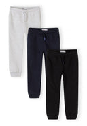 Three boys joggers in navy, grey, and black with drawstring waist and cuffed ankles showcasing casual kids fashion design.