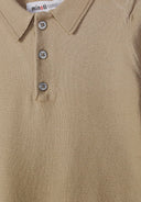 Close-up of a knitted stone-colored polo shirt with a classic collar and three buttons, showcasing soft texture and design.