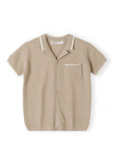 Beige knitted polo shirt with a lapel collar and button fastening, front view.