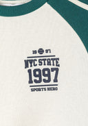 Detail of boys' sweatshirt with green contrast panels and NYC State 1997 print.