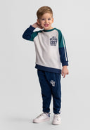 Boys' navy tracksuit with contrasting panels, front view, featuring a sweatshirt and joggers.