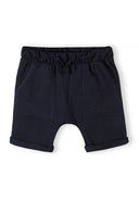 Black cotton jersey shorts for boys with elastic waist and rolled hems, designed for comfort and casual wear