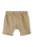 Camel-colored kids shorts with elastic waistband and rolled cuffs featuring a soft cotton slub jersey design