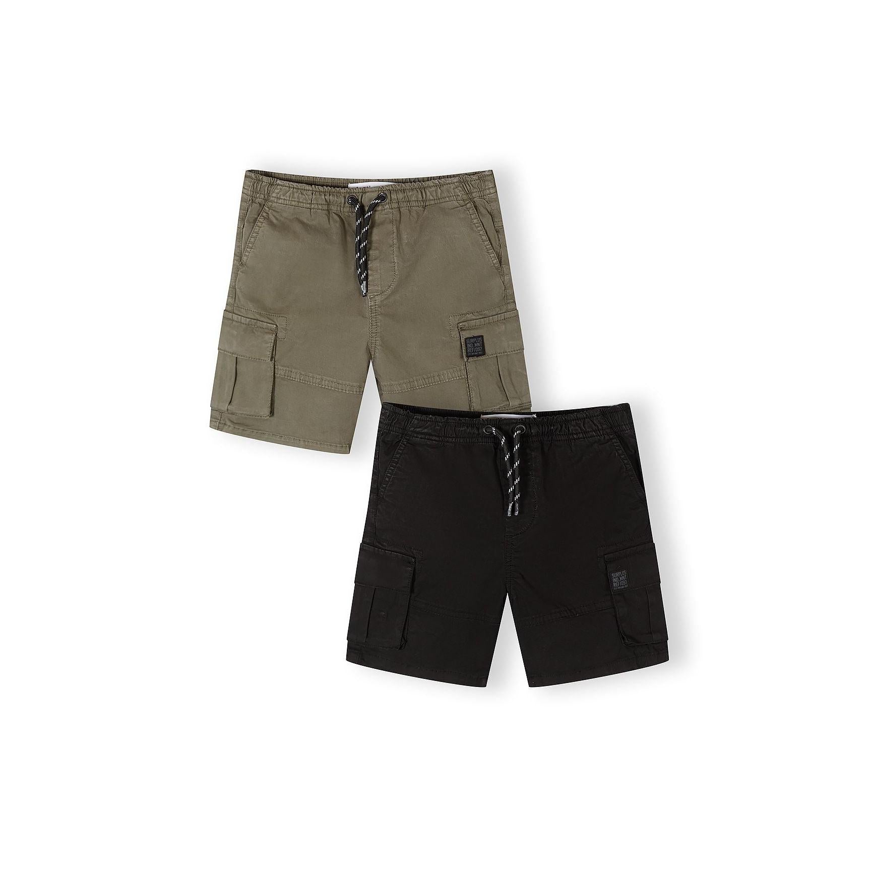 Two Minoti combat shorts laid flat on white background - one khaki green and one black, both featuring cargo pockets and drawstring waists