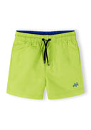 Boys swimming shorts in lime with elasticated waist and drawstring, front view.
