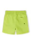 Boys swimming shorts in lime, back view with elasticated waist and side pocket.