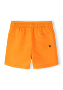 Bright orange kids' swim shorts with elasticated waistband and back pocket, designed for comfort and quick-dry performance.