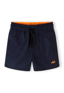 Navy boys quick-dry swim shorts with elasticated waist, drawstring, orange inner lining, and small logo detail design.
