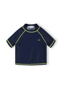 Navy kids rash top with lime stitching and logo, short sleeve, close-fitting design for active children.