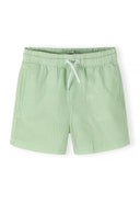Boys swim shorts, green and white striped, front view, elasticated waistband.