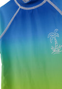 Close-up of a boys rash suit with a royal blue to green ombre design and palm tree graphic detail on the chest