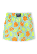 Kids swim shorts with playful lemon and orange slice design in bright mint and lemon colors