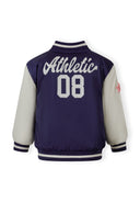 Navy and white varsity bomber jacket for girls with "Athletic 08" design on the back and striped cuffs and collar