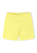 Soft pastel yellow cotton stretch bike shorts for girls with a simple and comfortable design for active wear.