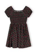 Girls black floral short sleeve dress, front view with structured shearing on the bodice.