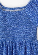 Blue floral dress with shirred bodice and short sleeves featuring a square neckline design for girls.