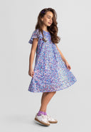 Girls blue a-line sequin dress with short sleeves, flowing skirt, and rounded neckline.