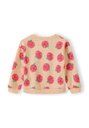 Kids sweatshirt in apricot with playful smiling apple prints and ribbed cuffs for a comfortable fit