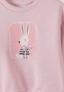 Pink girls sweatshirt featuring a charming bunny print with a bow, showcasing a playful and cute design.