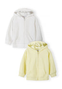 Two soft zip-up hoodies for girls in white and pale yellow with a simple, comfortable design for kids.