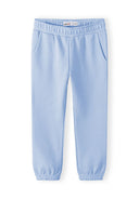 Light blue girls joggers with side pockets and elastic waistband, designed for comfort and style.