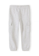 Girls light grey joggers with cargo pockets and elastic cuffs featuring a comfortable, stylish design for kids.