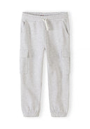 Light grey girls joggers with cargo pockets and drawstring, featuring a comfortable elastic waistband and ankle cuffs.