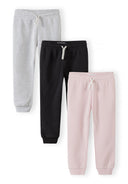 Three girls joggers in pink, grey, and black with elastic waist and side pockets, designed for comfort and style.