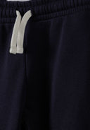 Close-up of navy joggers waistband with white drawstring, designed for comfortable kids and baby fashion.