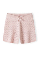 Soft pink knitted shorts for girls featuring a delicate pointelle design and a drawstring waist for comfort.