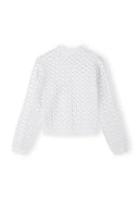 White girls cardigan with wavy trim and intricate textured design, made from soft viscose blend fabric.