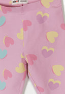 Close-up of purple kids leggings with colorful heart patterns showcasing a playful and unique design.