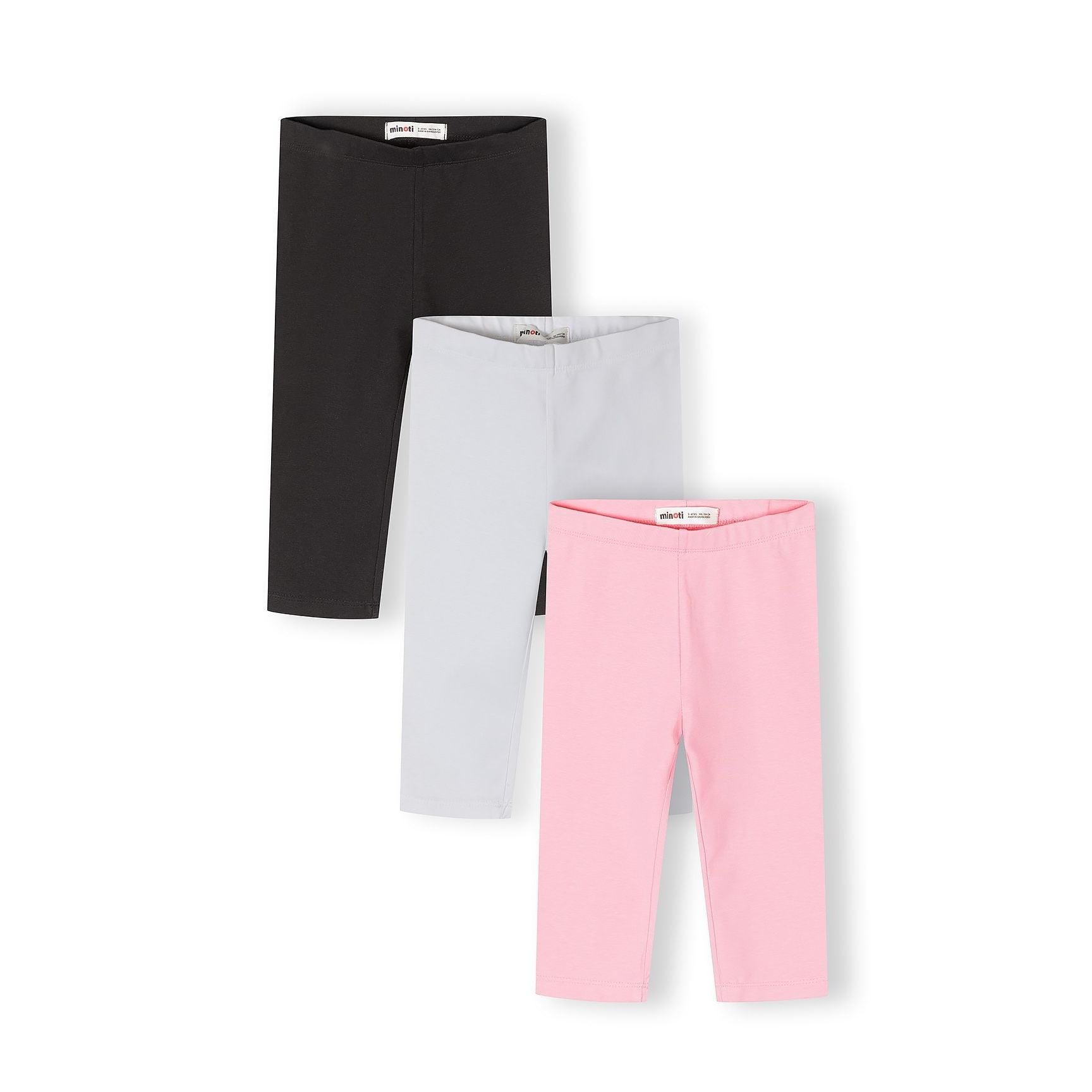 Three capri leggings laid flat showing black, grey and pink colours with Minoti labels visible on waistbands against white background