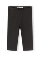 Simple black capri leggings for girls with elasticated waistband, designed for comfort and everyday wear.