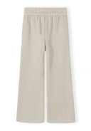 Beige wide leg joggers for girls with an adjustable waist and side pockets, featuring a comfortable and stylish design.