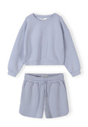 Light blue girls sweatshirt and shorts set with elastic waist and stylish relaxed design for baby fashion.