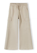 Beige wide leg joggers with elasticated waistband and cargo pockets, featuring a soft breathable fabric design.