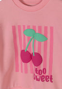 Pink fabric with a playful cherry design and "too sweet" text on a kids' casual top design.