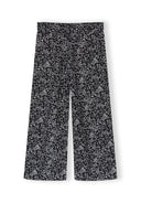 Black wide leg trousers with white floral print design for girls aged 3 to 15 years, stylish and comfortable fit.