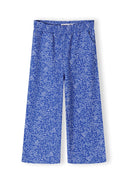 Girls loose fit blue trousers with white floral design and adjustable waistband for comfort and style