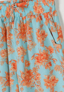 Light blue viscose fabric with orange floral design and elastic waistband with drawstring detailing