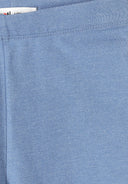 Close-up of soft melange blue fabric with elasticated waistband detail in girls cycling shorts design.